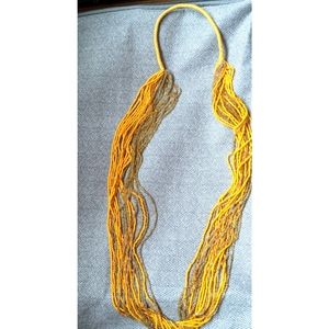 Long beaded necklace in yellow